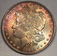 1889  Morgan Dollar, MS64, Beautiful even gray/burgundy obv toning and circular gold and blue rev toning. Exact coin imaged.