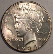 1934 Peace Dollar, Grade MS60, scuff in front of face prevents it from grading higher