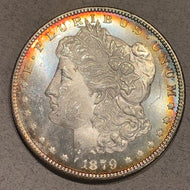 1879 S Morgan Dollar, MS64 PQ, with attractive rainbow rim toning. Unfortunately has a scratch behind head. Priced as MS63. 