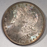 1883 O  Morgan Dollar, MS64, attractive mottled pastle rainbow toning.