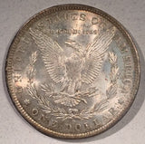 1883 O  Morgan Dollar, MS64, attractive mottled pastle rainbow toning.
