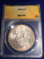 1883 O Morgan Dollar, ANACS slab MS64 gold toning around rim of both sides