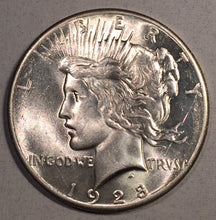 1928 Peace Dollar, Grade UNC, Fabulous white lustrous coin but has one staple scratch behind Liberty's head