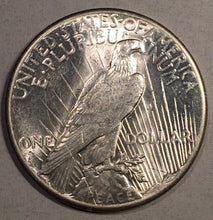 1928 Peace Dollar, Grade UNC, Fabulous white lustrous coin but has one staple scratch behind Liberty's head