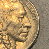 1914 Buffalo Nickel, Grade= MS63, cleaned at some point but now toned even gold. Also has a double profile